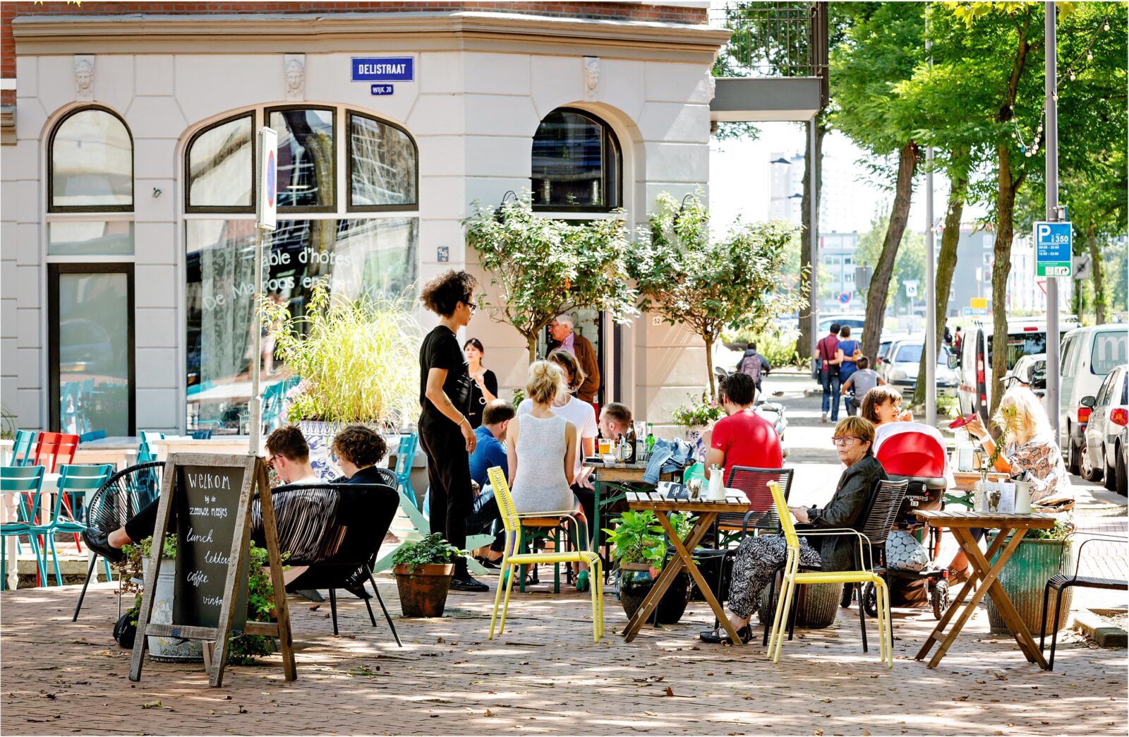 people enjoying being sat outside a cafe in the city centre