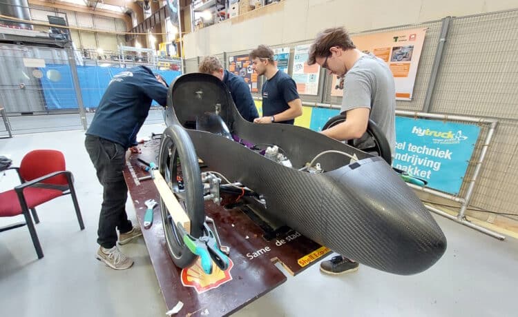 Student engineers building a custom car